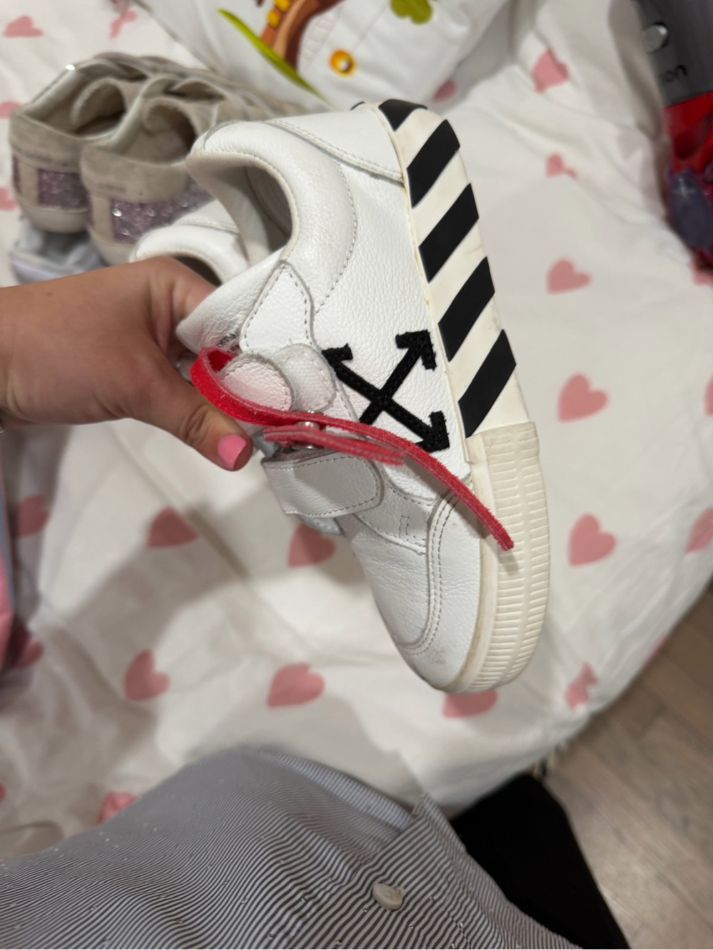 Off- White Sneakers with Black Arrow Logo and Red Lace Accent